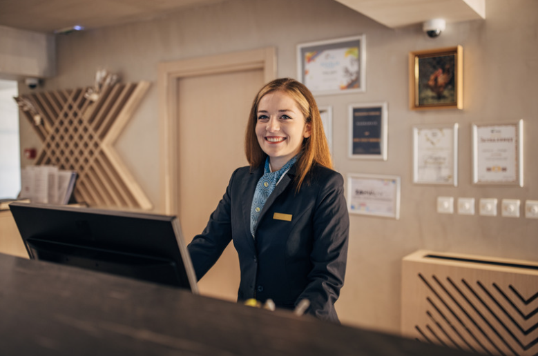 woman working at hotel front desk
